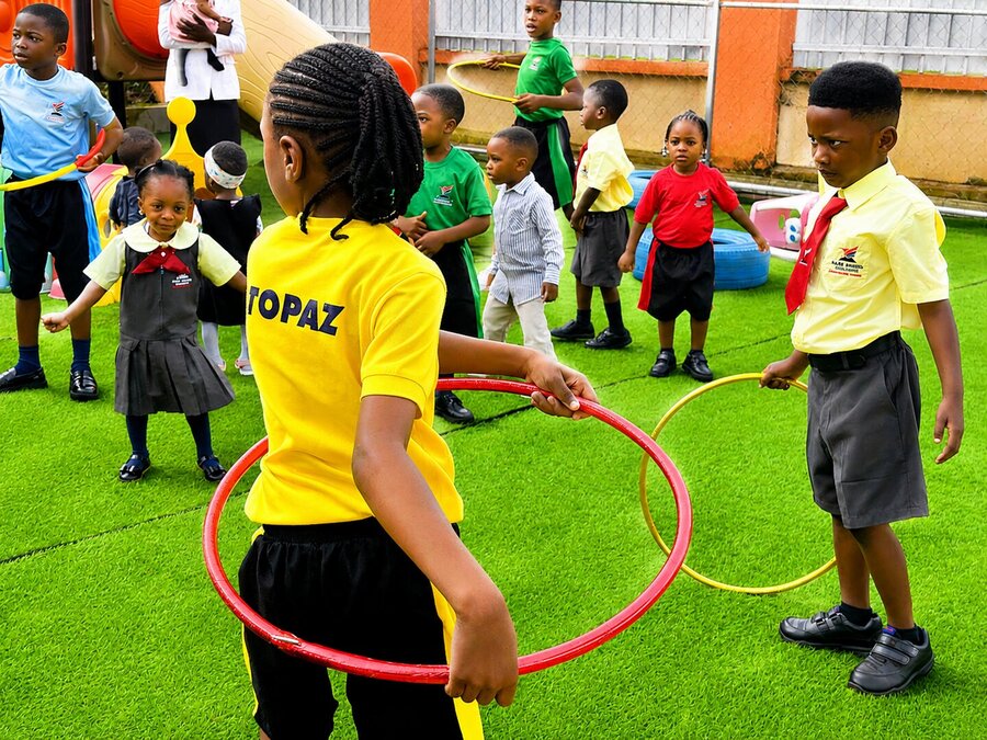 Children playing with hula hoops