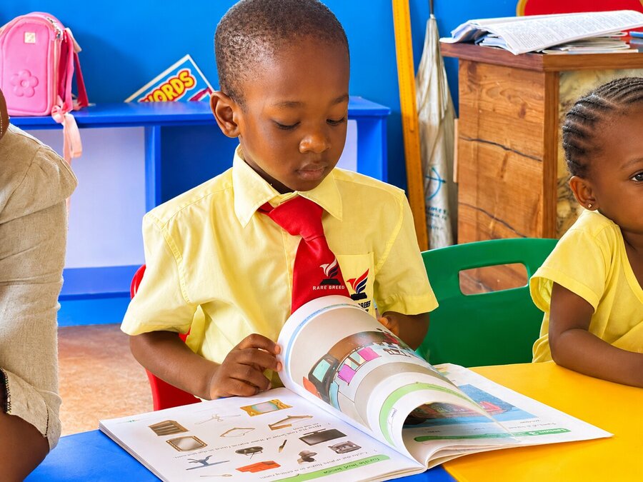 A pupil reading at school