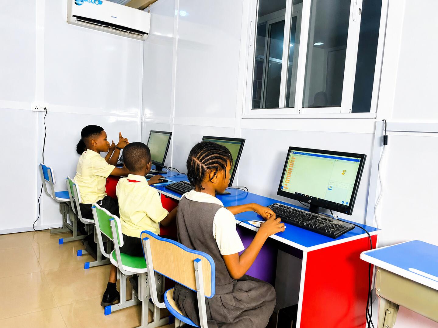Pupils using computers in the lab