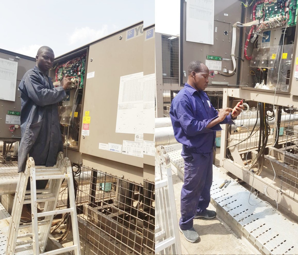Technicians working on HVAC equipment